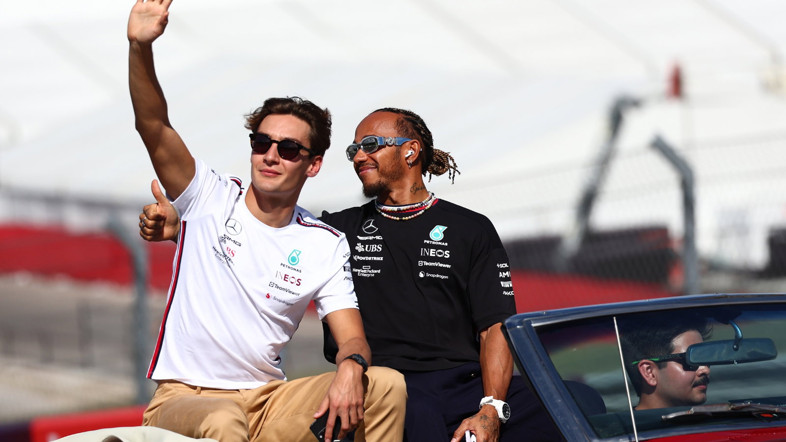 (L to R): George Russell (GBR) Mercedes AMG F1 and Lewis Hamilton (GBR) Mercedes AMG F1 on the drivers' parade. Formula 1