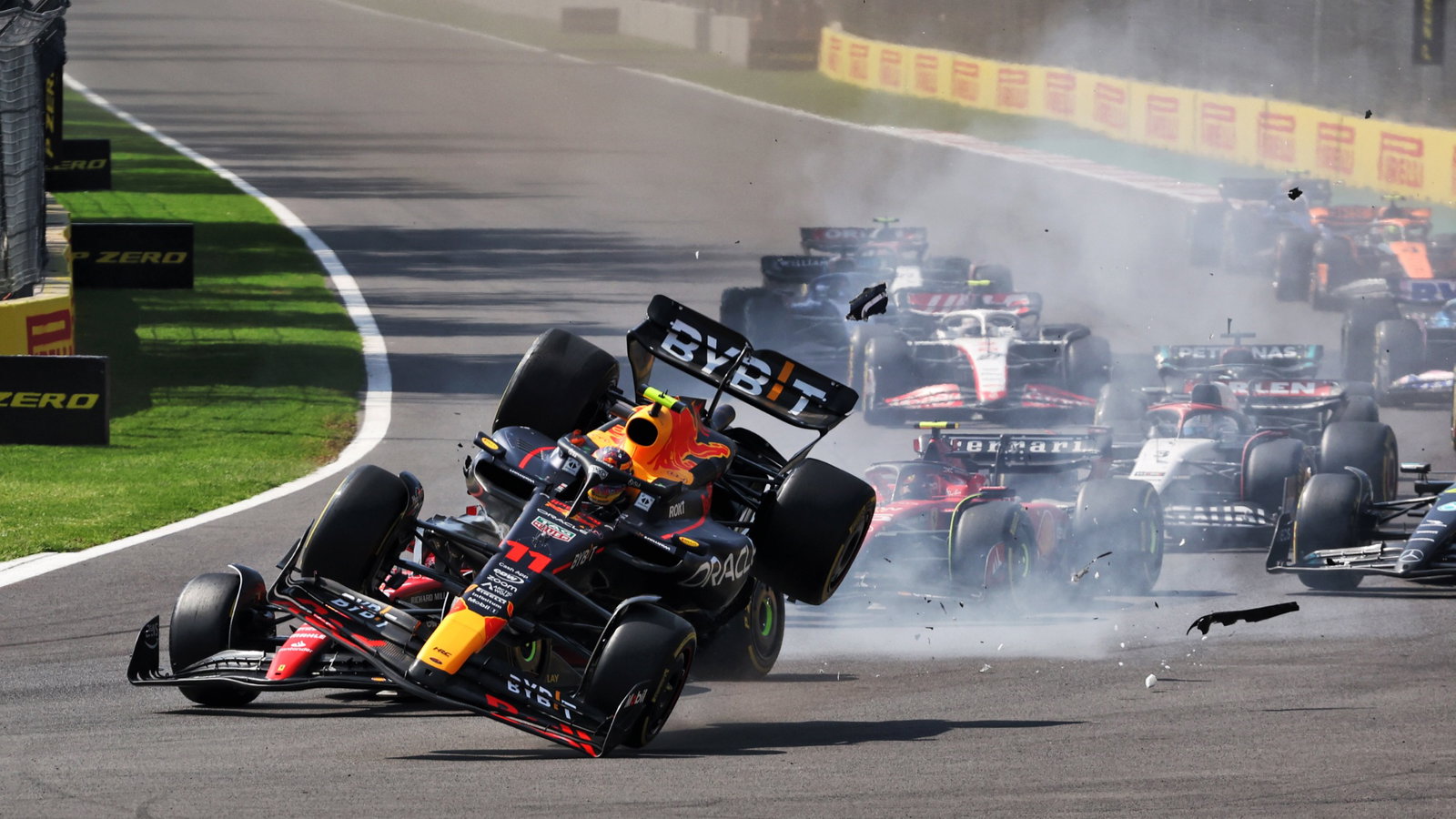 Charles Leclerc (MON) Ferrari SF-23 and Sergio Perez (MEX) Red Bull Racing RB19 - crash at the start of the race. Formula