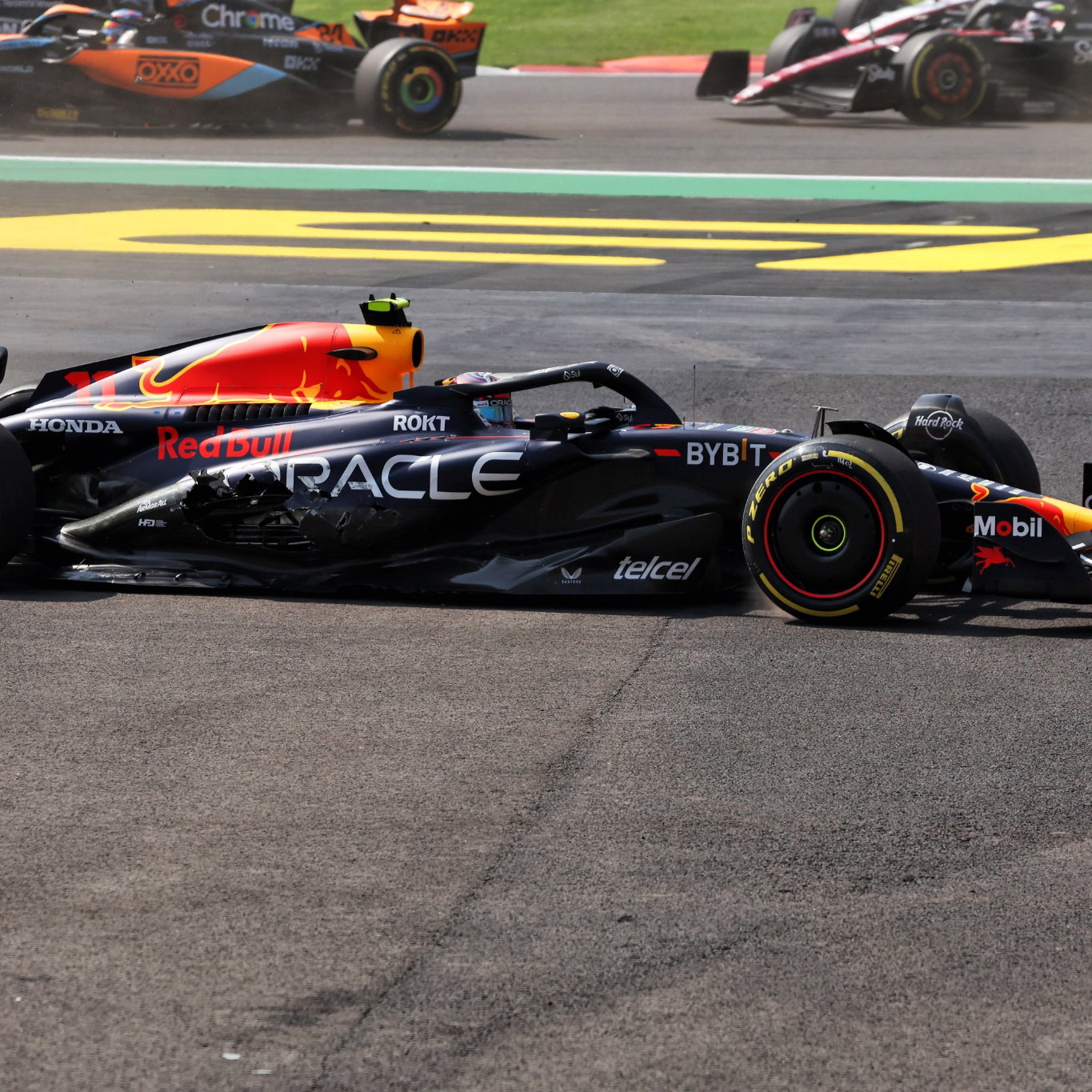 Sergio Perez (MEX) Red Bull Racing RB19 - crash at the start of the race. Formula 1 World Championship, Rd 20, Mexican