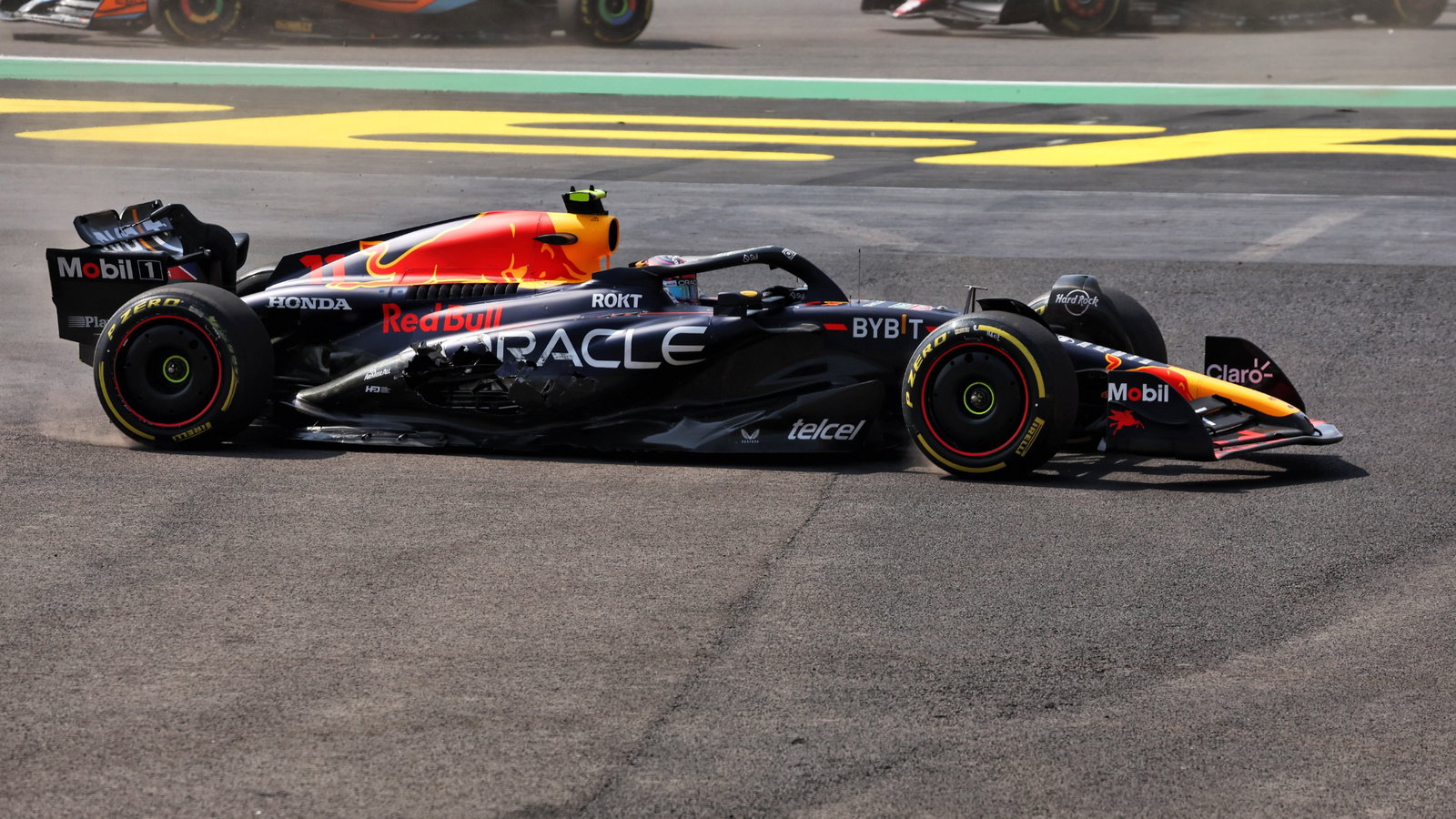 Sergio Perez (MEX) Red Bull Racing RB19 - crash at the start of the race. Formula 1 World Championship, Rd 20, Mexican