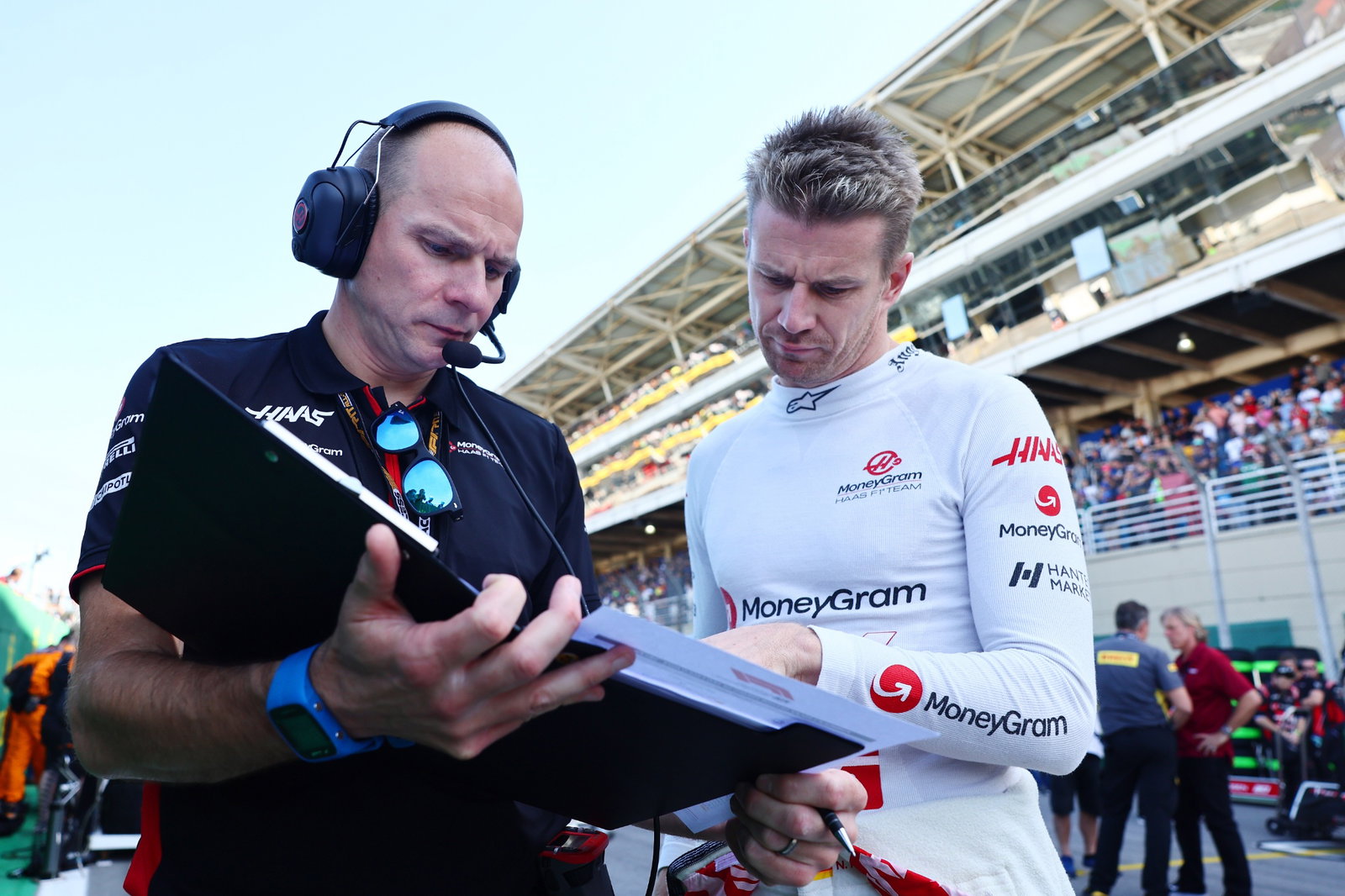 Nico Hulkenberg (GER) Haas F1 Team with Gary Gannon (GBR) Haas F1 Team Race Engineer on the grid. Formula 1 World