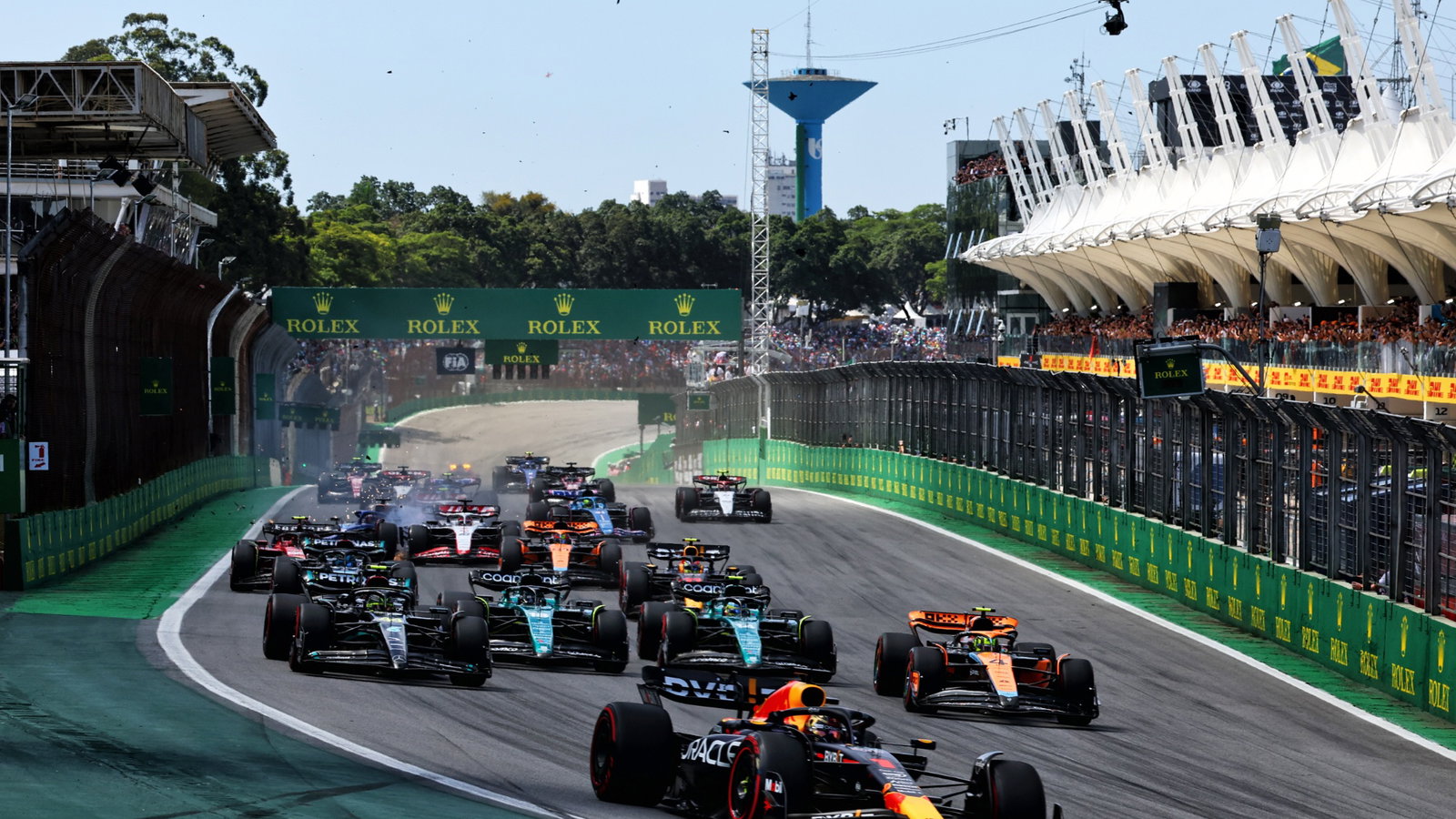 Max Verstappen (NLD) Red Bull Racing RB19 leads at the start of the race as Alexander Albon (THA) Williams Racing FW45 and
