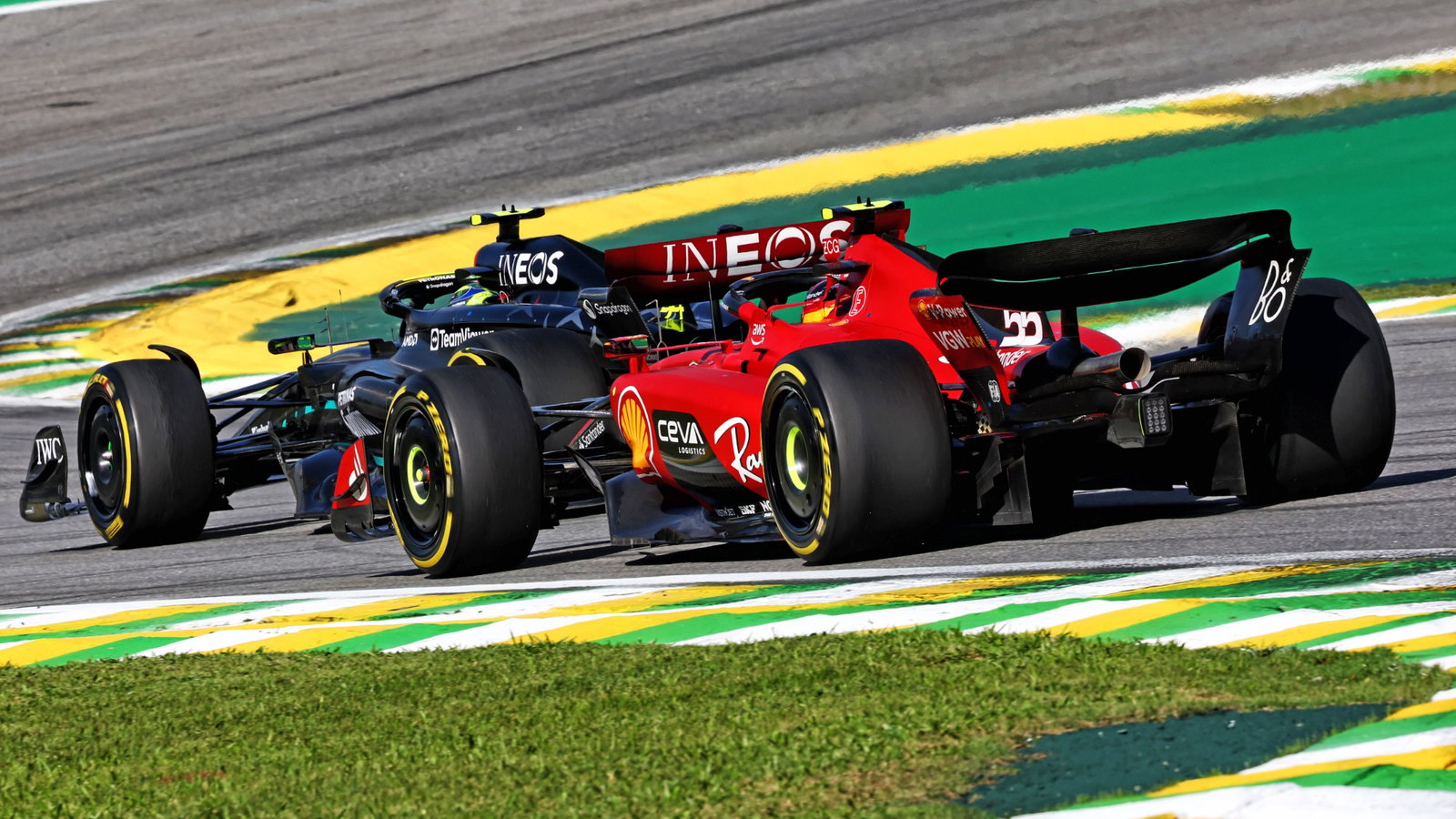 Lewis Hamilton (GBR) Mercedes AMG F1 W14 leads Carlos Sainz Jr (ESP) Ferrari SF-23. Formula 1 World Championship, Rd 21,