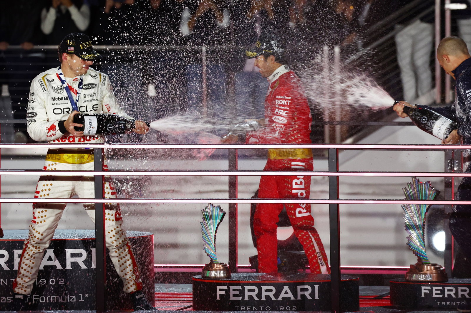 (L to R): Race winner Max Verstappen (NLD) Red Bull Racing celebrates on the podium with third placed Sergio Perez (MEX) Red