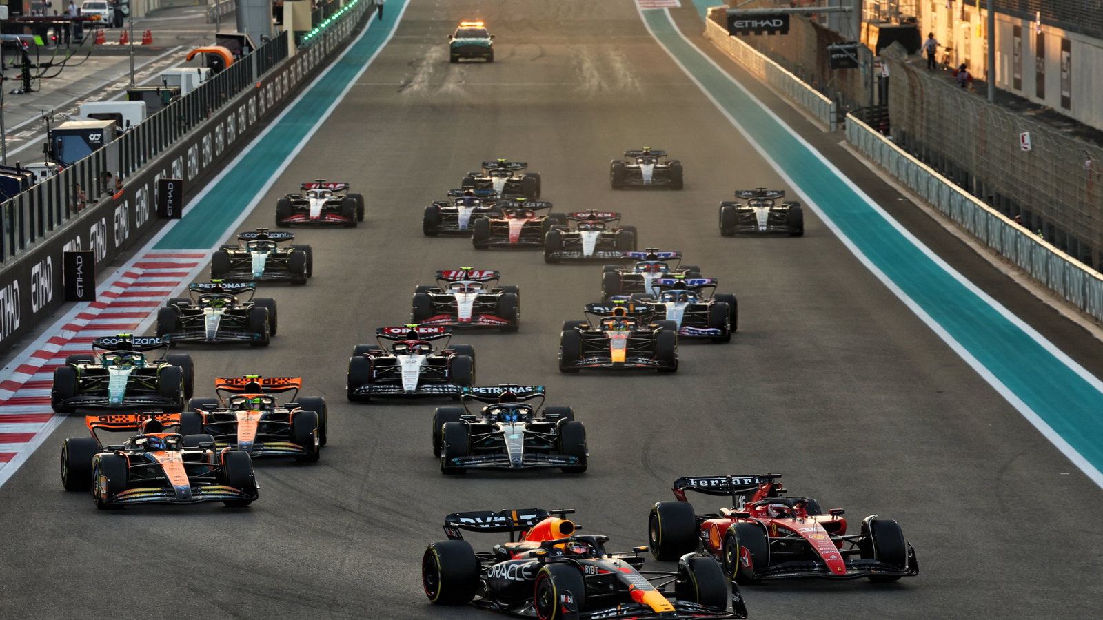 Max Verstappen (NLD) Red Bull Racing RB19 leads Charles Leclerc (MON) Ferrari SF-23 at the start of the race. Formula 1