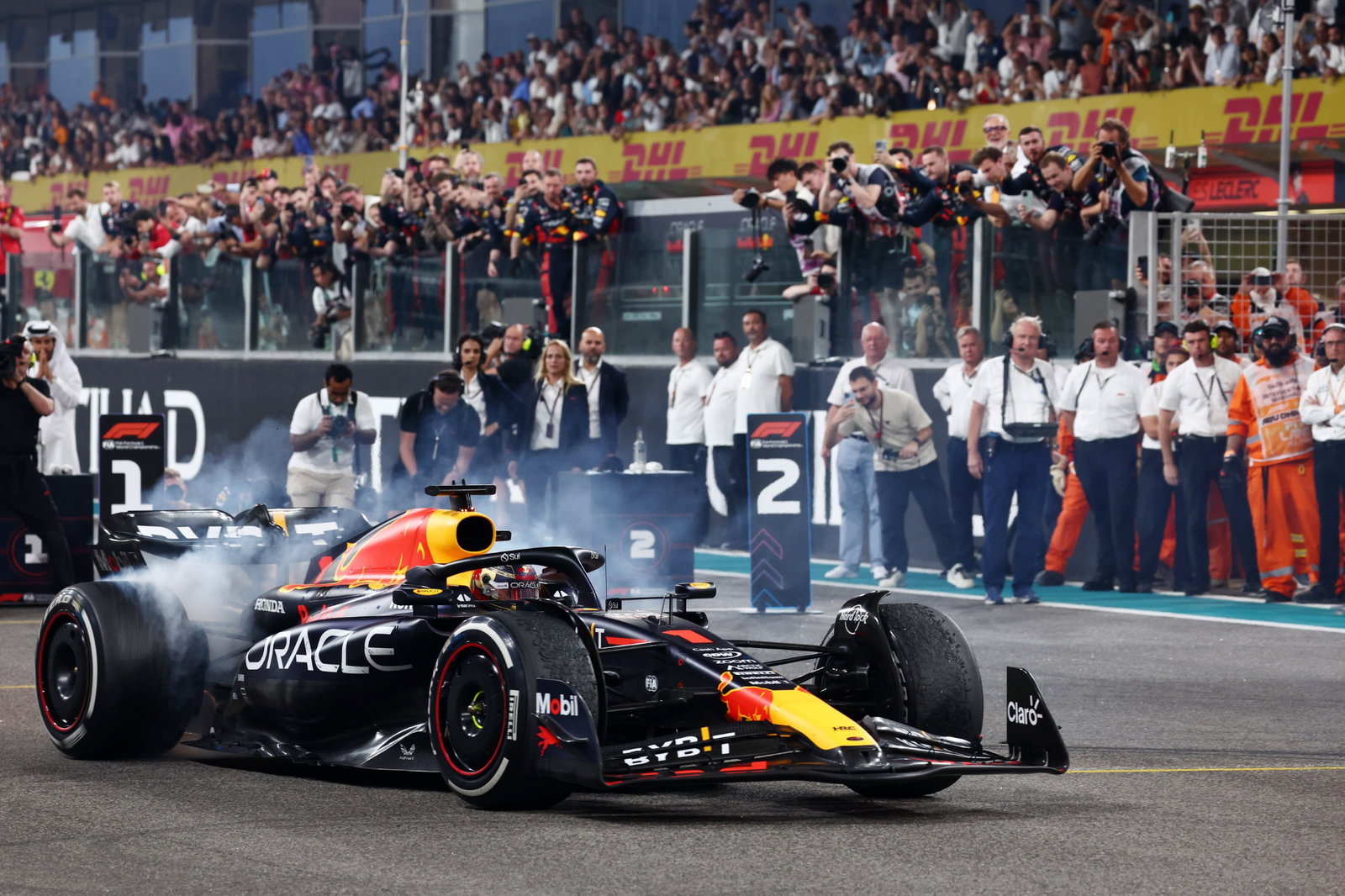 Race winner Max Verstappen (NLD) Red Bull Racing RB19 celebrates with doughnuts at the end of the race in parc ferme.
