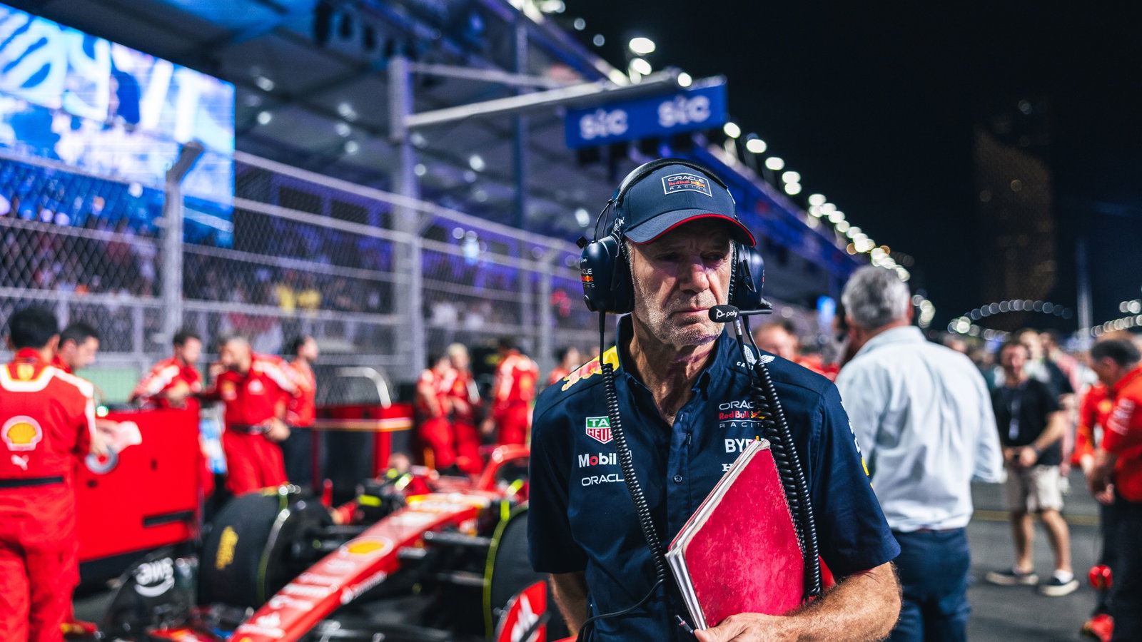 Adrian Newey (GBR) Red Bull Racing Chief Technical Officer looks at Oliver Bearman (GBR) Ferrari SF-24 Reserve Driver on the