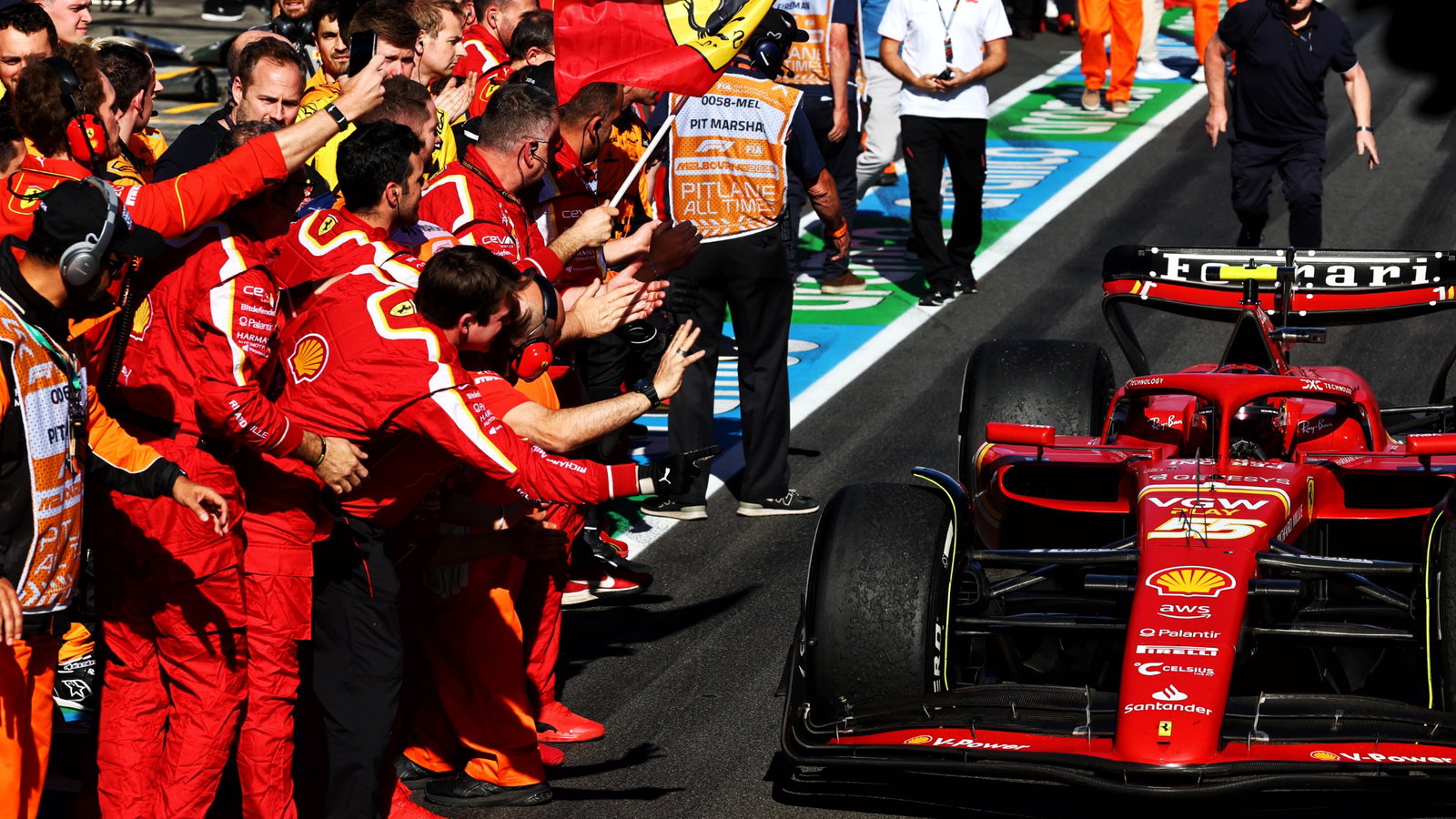 Race winner Carlos Sainz Jr (ESP) Ferrari SF-24 passes the team as he enters parc ferme at the end of the race. Formula 1