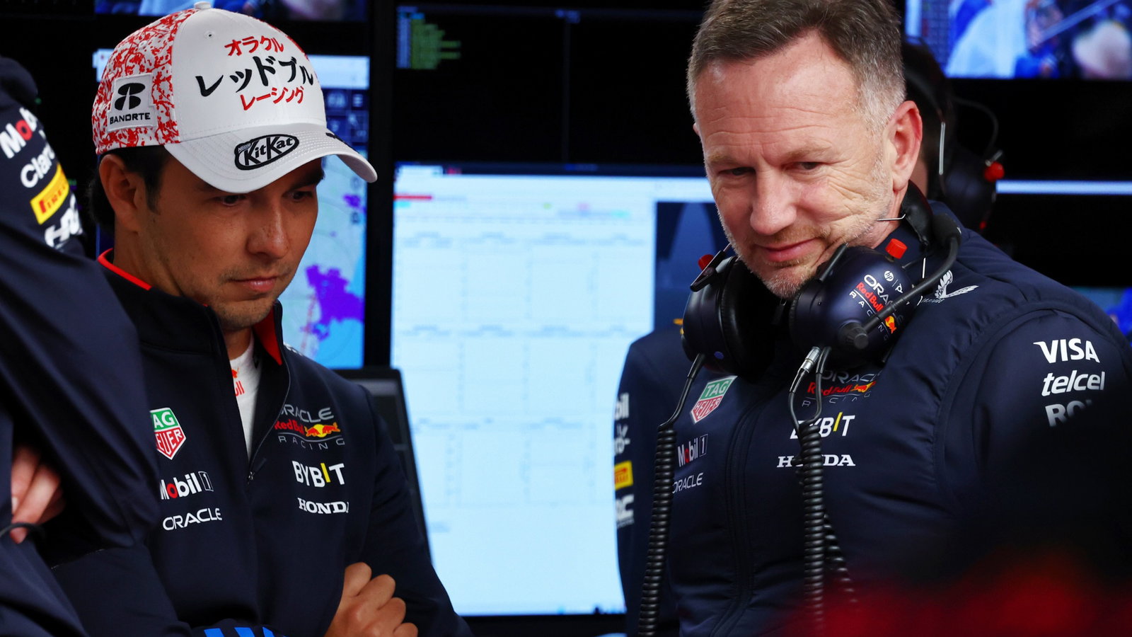 (L to R): Sergio Perez (MEX) Red Bull Racing with Christian Horner (GBR) Red Bull Racing Team Principal. Formula 1 World