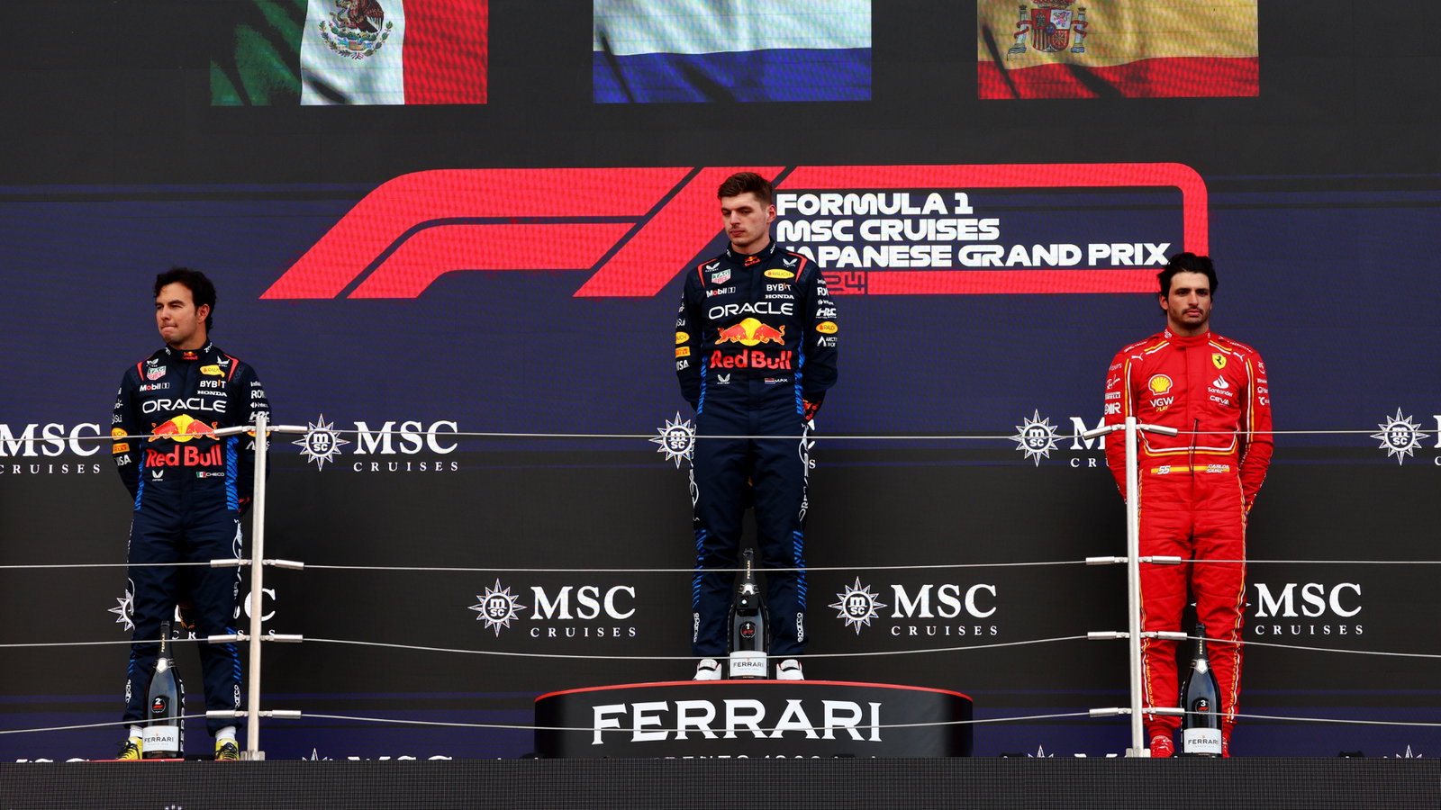 The podium (L to R): Sergio Perez (MEX) Red Bull Racing, second; Max Verstappen (NLD) Red Bull Racing, race winner; Carlos