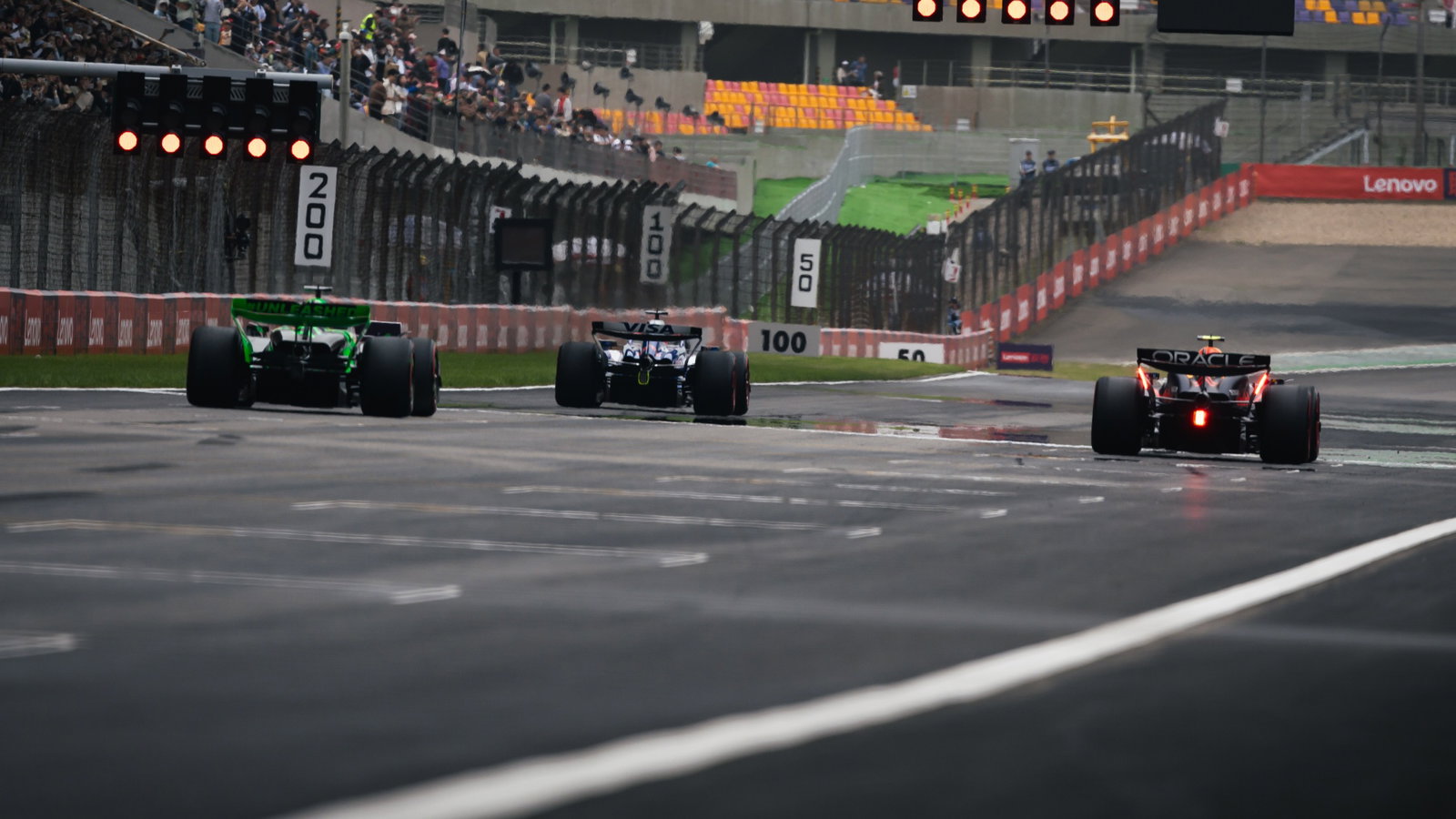 Daniel Ricciardo (AUS) RB VCARB 01; Sergio Perez (MEX) Red Bull Racing RB20; and Valtteri Bottas (FIN) Sauber C44. Formula