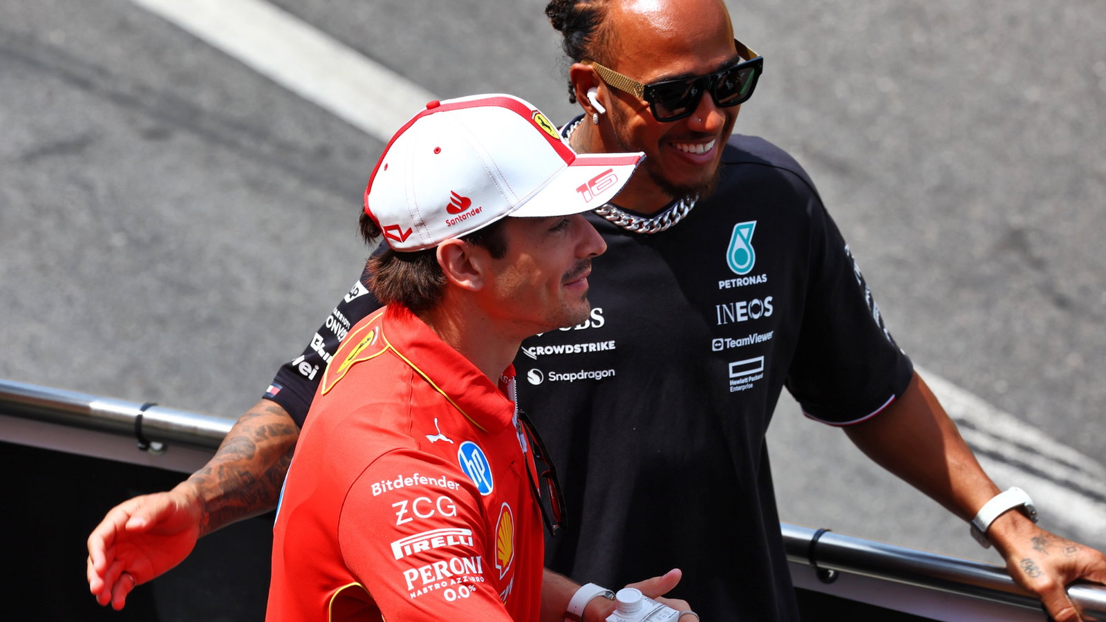 (L to R): Charles Leclerc (MON) Ferrari and Lewis Hamilton (GBR) Mercedes AMG F1 on the drivers' parade. Formula 1 World