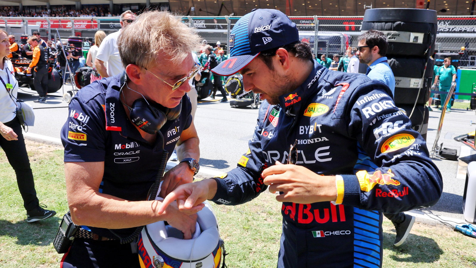 Sergio Perez (MEX) Red Bull Racing with Xavi Martos (ESP) Red Bull Racing F1 Team Physio on the grid. Formula 1 World