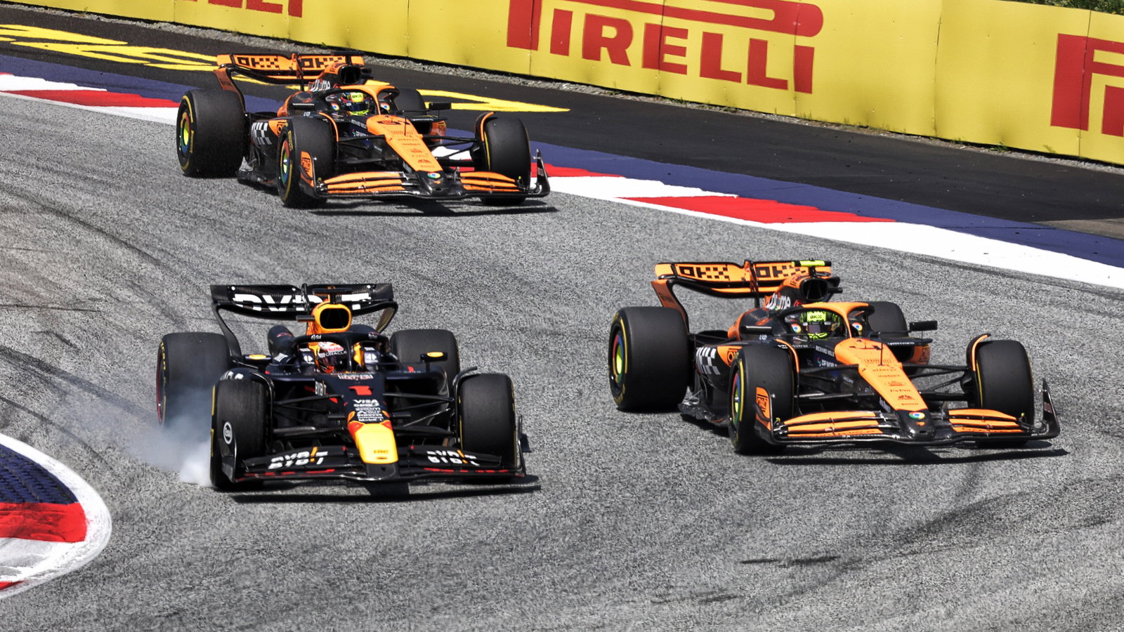 Max Verstappen (NLD) Red Bull Racing RB20 and Lando Norris (GBR) McLaren MCL38 battle for the lead of the race. Formula 1