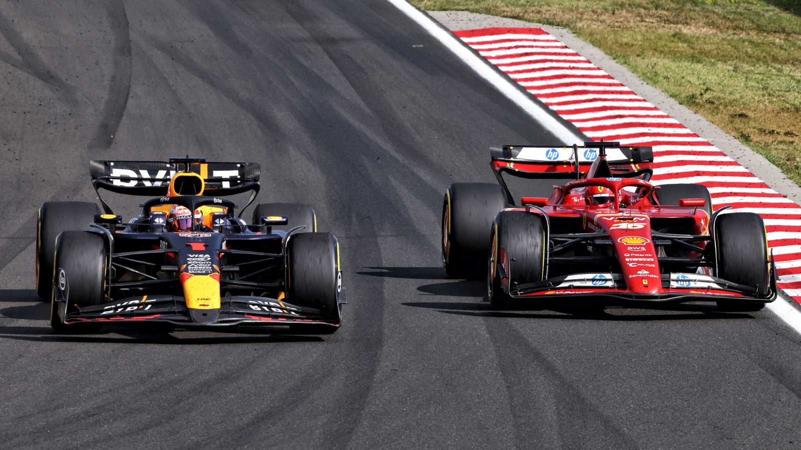 Max Verstappen (NLD) Red Bull Racing RB20 and Charles Leclerc (MON) Ferrari SF-24 battle for position. Formula 1 World