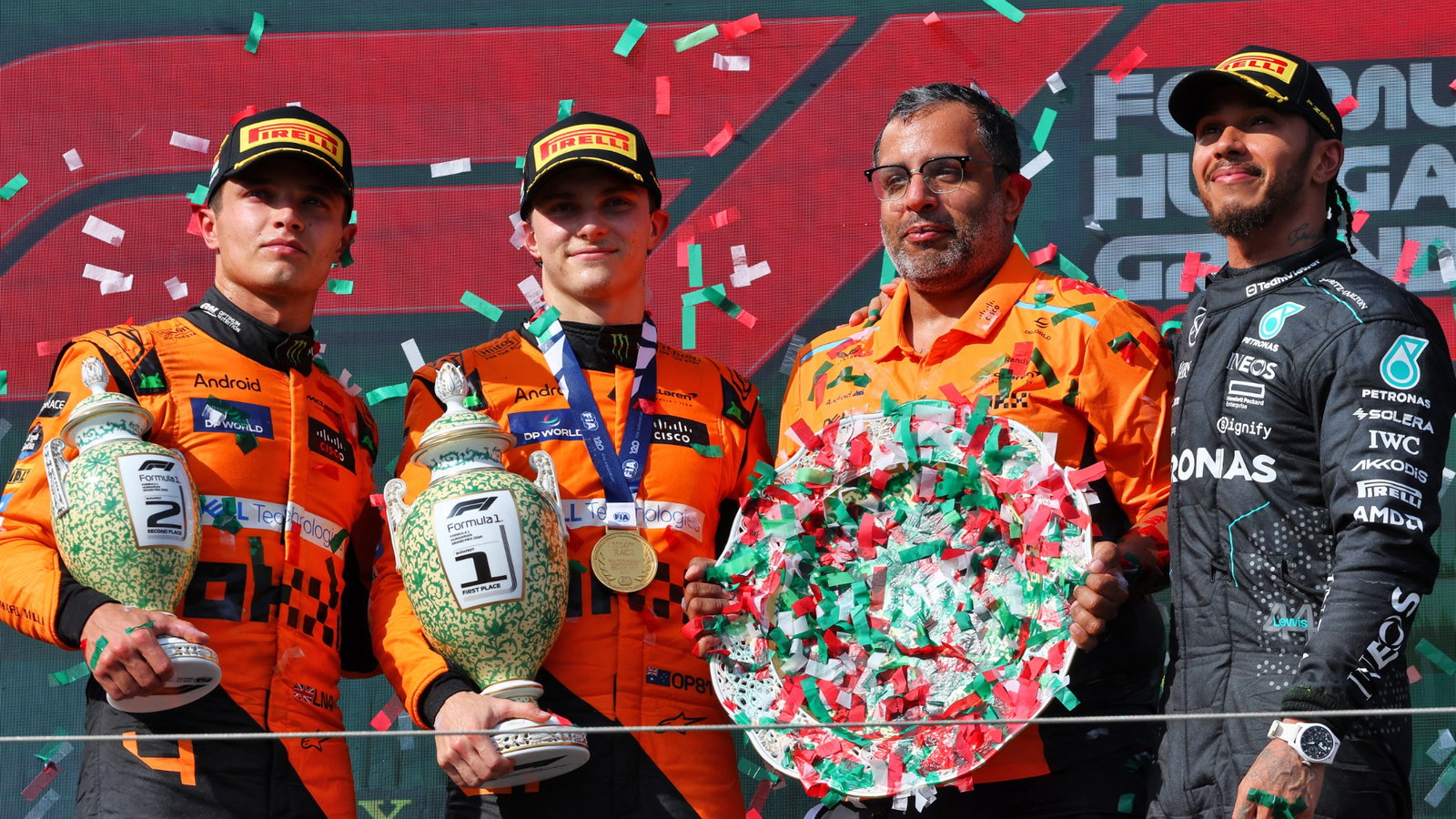 The podium (L to R): Lando Norris (GBR) McLaren, second; Oscar Piastri (AUS) McLaren, race winner; Randy Singh (GBR) McLaren