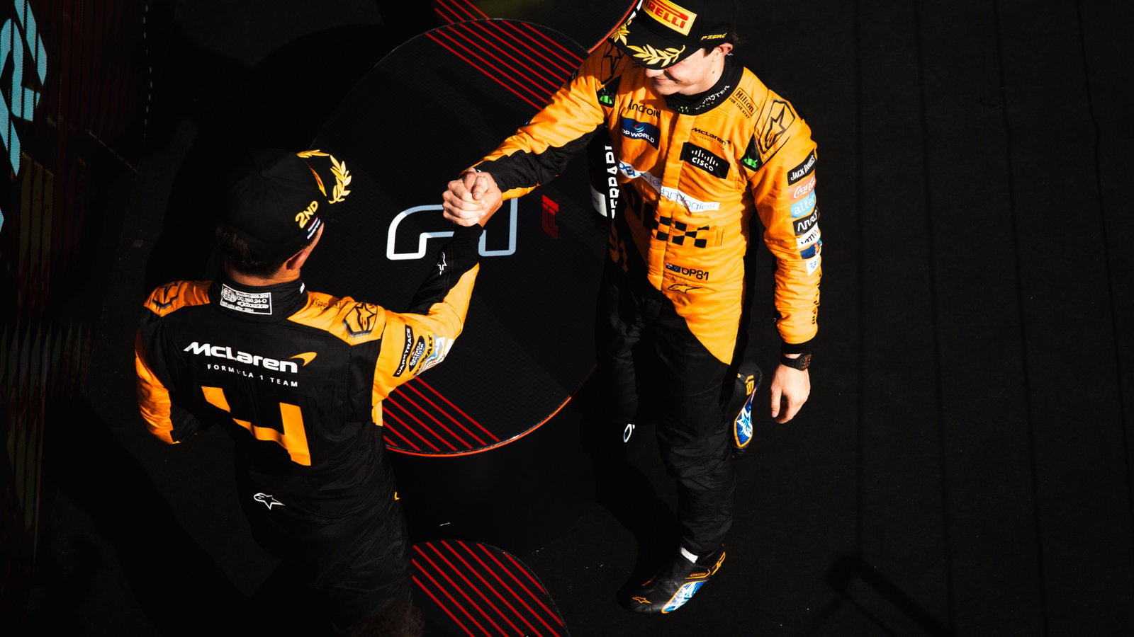 Race winner Oscar Piastri (AUS) McLaren celebrates on the podium with second placed team mate Lando Norris (GBR) McLaren.