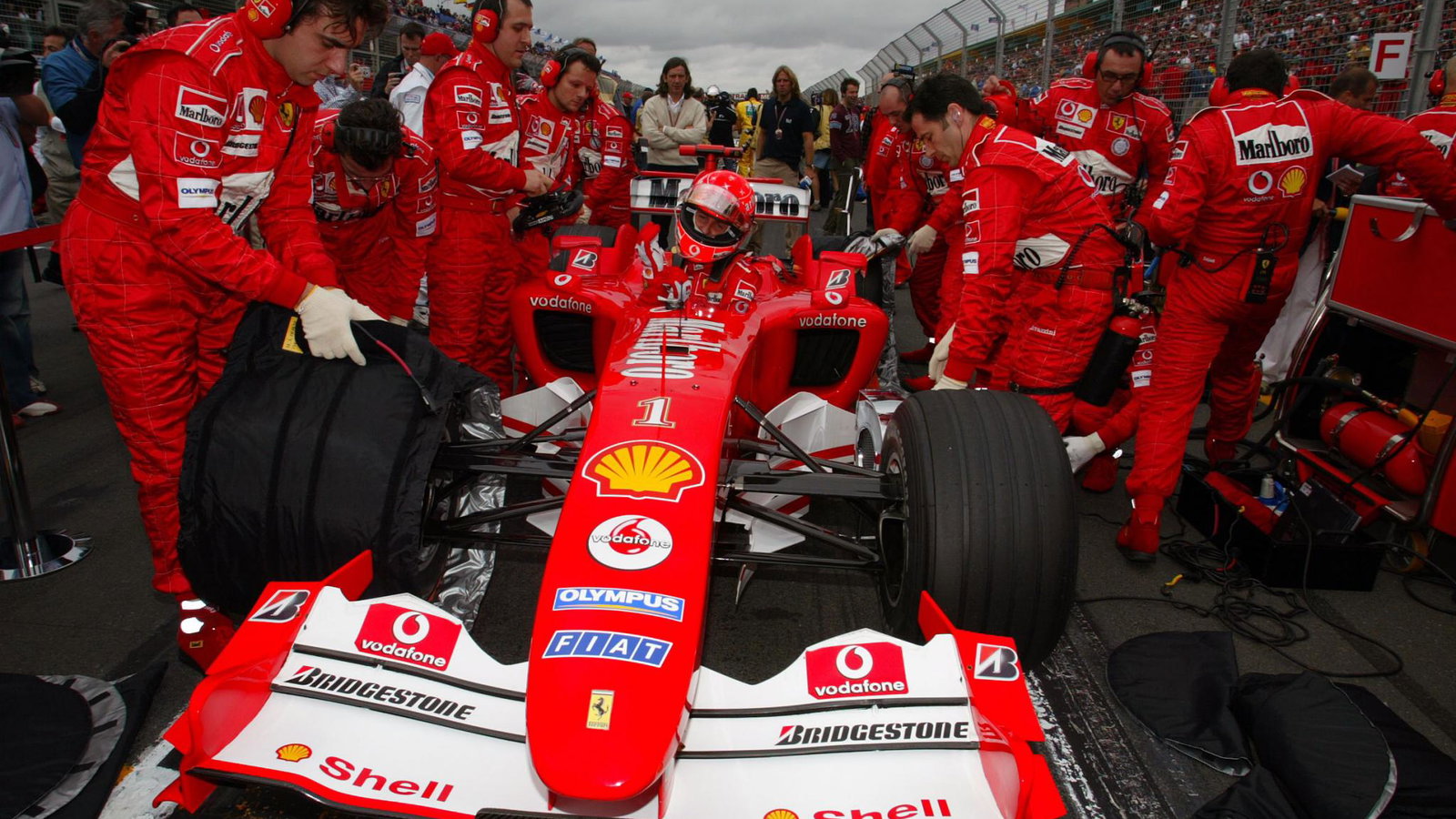 Michael Schumacher climbs into his Ferrari F2004 on the grid at the Australian GP